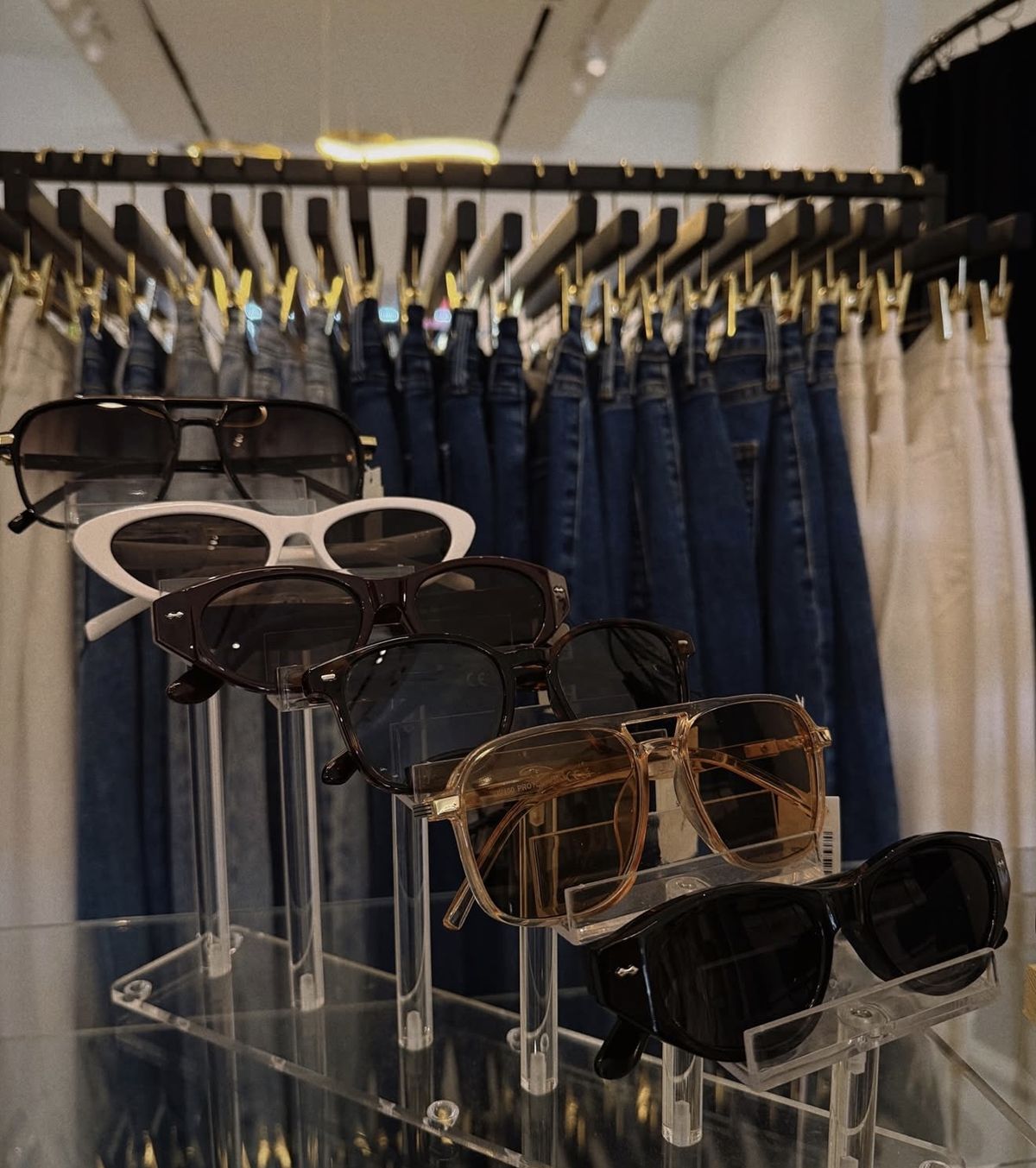 Sunglasses display in front of denim