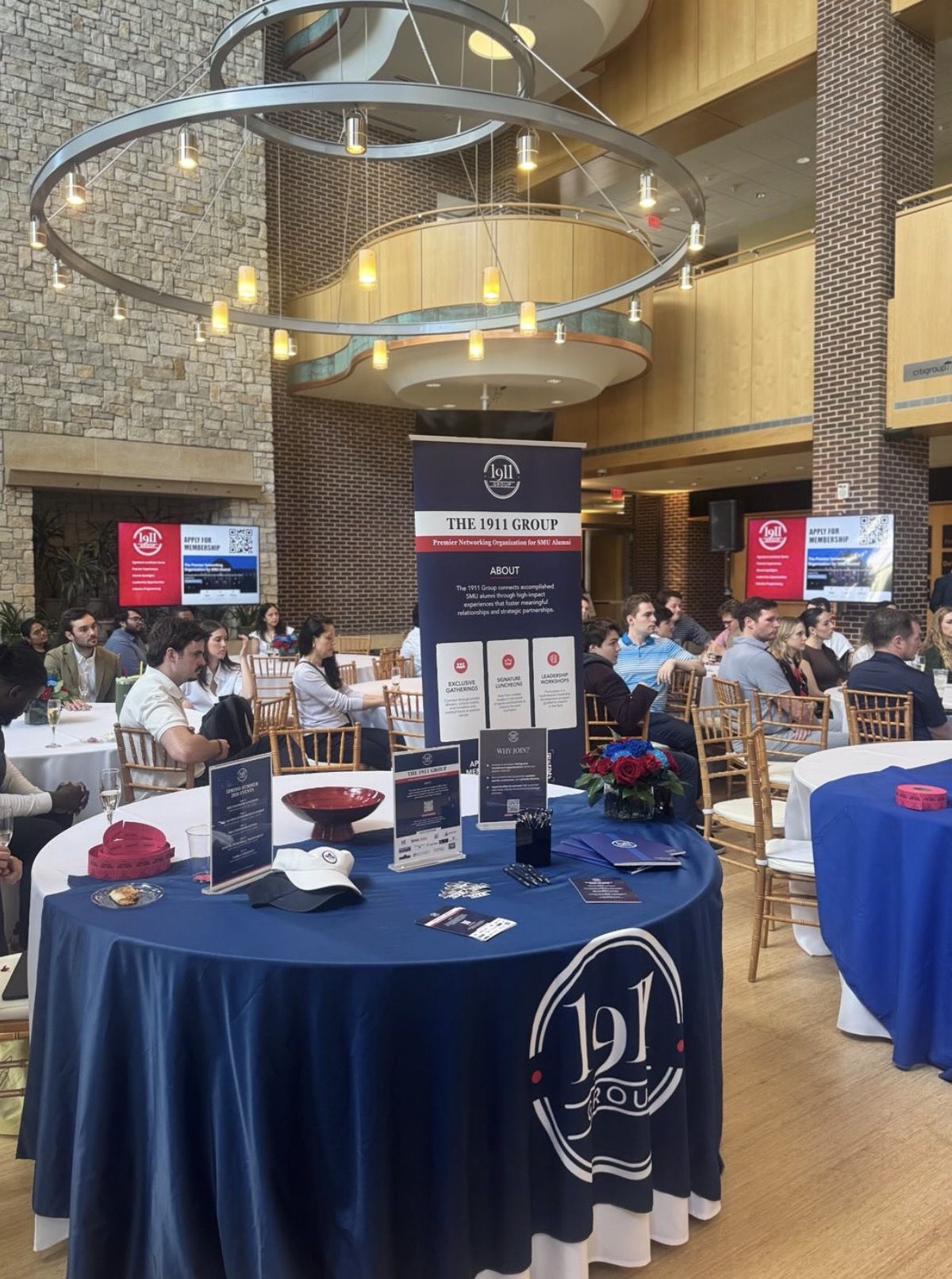 1911 Group branded booth at a luncheon